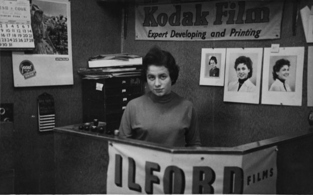 at Work in a photo shop, late 50s